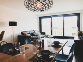 Cosy, trendy en zuid gelegen ruim appartement op 100m van strand en winkelstraat